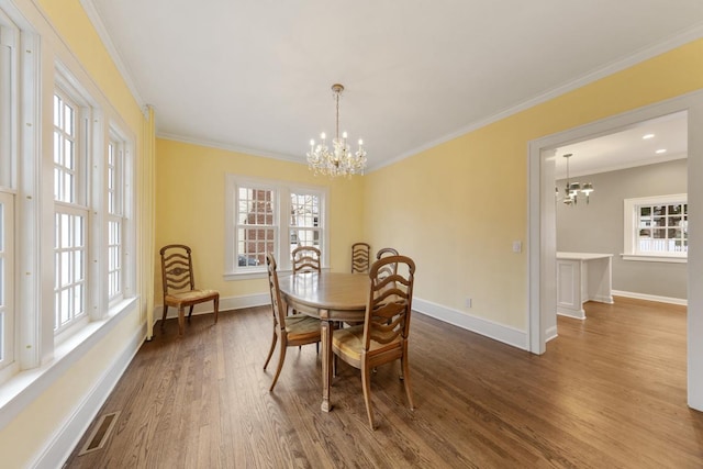 525 Main St, Owatonna, MN 55060 - dining area featuring a notable chandelier, baseboards, and plenty of natural light