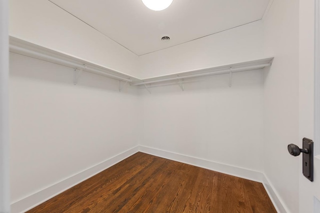 525 Main St, Owatonna, MN 55060 - walk in closet featuring dark wood-type flooring