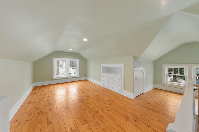 525 Main St, Owatonna, MN 55060 - bonus room with baseboards, light wood-type flooring, vaulted ceiling, recessed lighting, and radiator