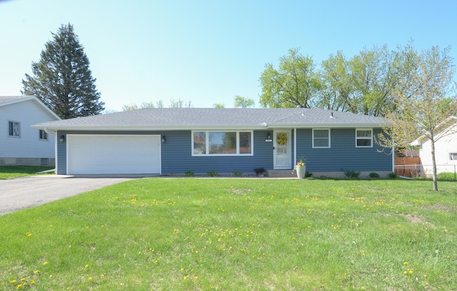 single story home with a garage and asphalt driveway