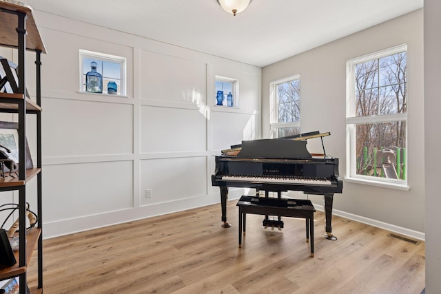 6921 Huckleberry Dr, Minnetrista, MN 55331 - living area with light wood-type flooring and baseboards