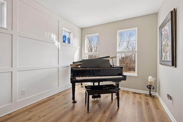 6921 Huckleberry Dr, Minnetrista, MN 55331 - living area with light wood finished floors and baseboards