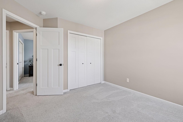 6921 Huckleberry Dr, Minnetrista, MN 55331 - unfurnished bedroom featuring carpet flooring and a closet