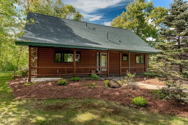 33507 Old 371, Pequot Lakes, MN 56472 - rustic home featuring a shingled roof and covered porch