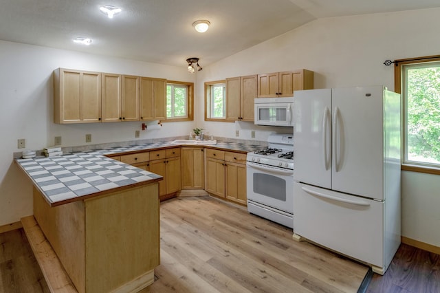 33507 Old 371, Pequot Lakes, MN 56472 - kitchen featuring white appliances, light brown cabinetry, a peninsula, and vaulted ceiling