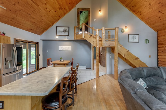 33507 Old 371, Pequot Lakes, MN 56472 - kitchen featuring stainless steel fridge, wooden ceiling, high vaulted ceiling, light wood finished floors, and open floor plan