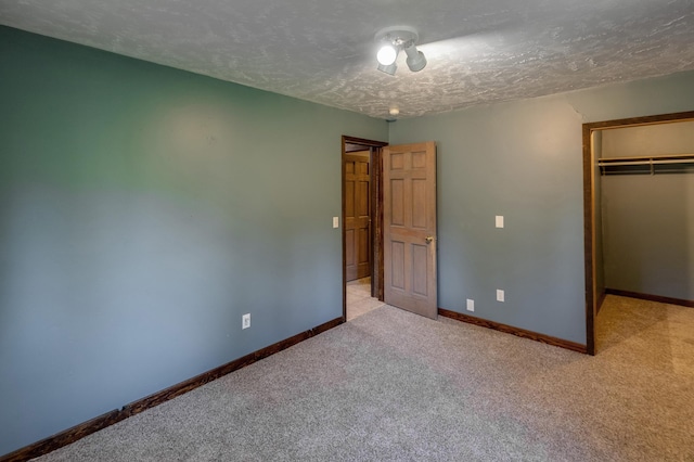 33507 Old 371, Pequot Lakes, MN 56472 - unfurnished bedroom with a textured ceiling, light carpet, a closet, and a spacious closet