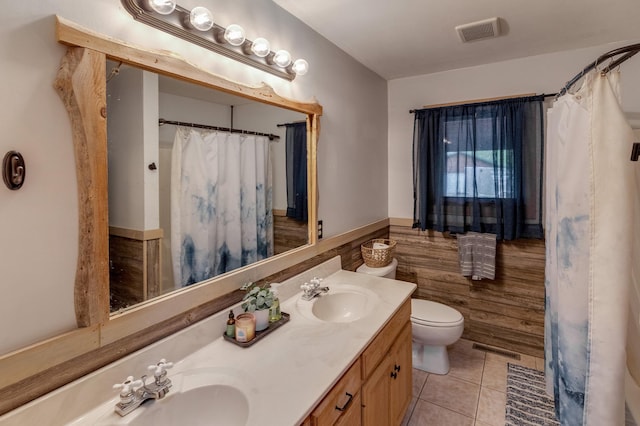 33507 Old 371, Pequot Lakes, MN 56472 - bathroom featuring double vanity, wainscoting, tile patterned floors, and a shower with curtain