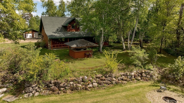 33507 Old 371, Pequot Lakes, MN 56472 - view of green lawn with a detached garage, an outdoor fire pit, and an outbuilding