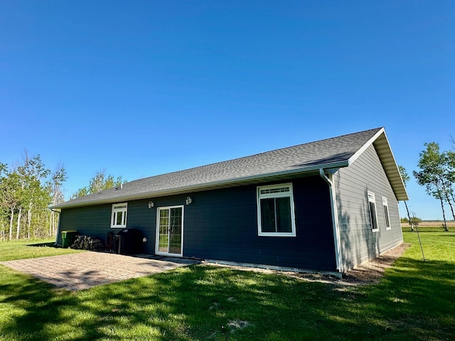 31526 270th St, Badger, MN 56714 - rear view of property featuring a lawn and a patio