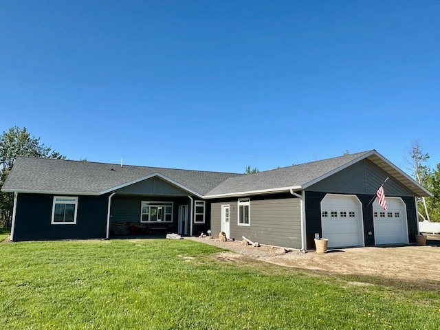 31526 270th St, Badger, MN 56714 - ranch-style house with a front lawn, an attached garage, driveway, and a shingled roof