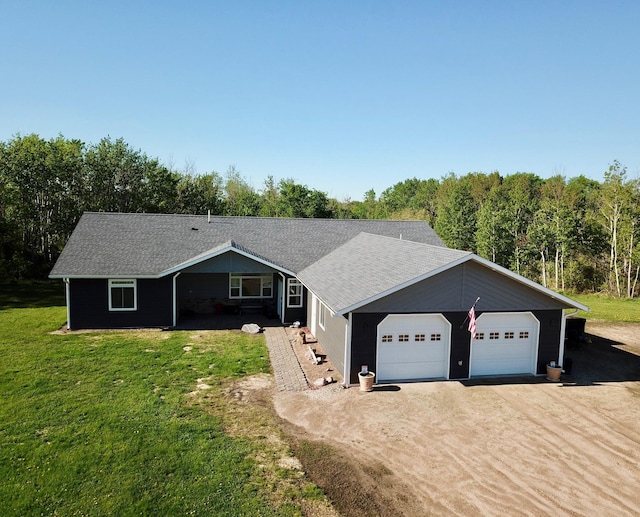 31526 270th St, Badger, MN 56714 - ranch-style home featuring driveway, a front yard, and a shingled roof