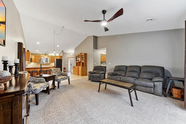 living area featuring recessed lighting, lofted ceiling, a ceiling fan, and light carpet