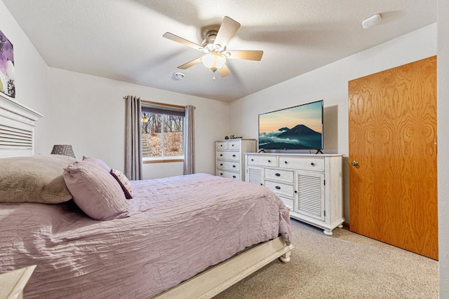 carpeted bedroom with a ceiling fan