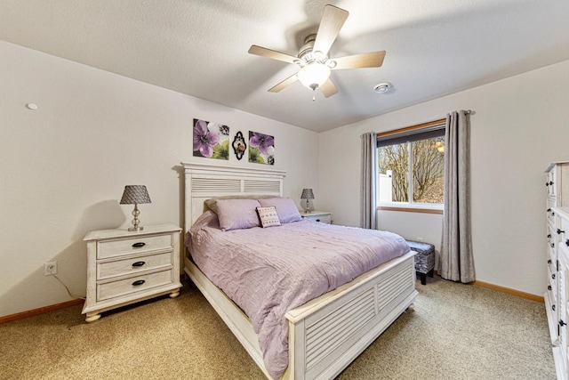 bedroom with baseboards, ceiling fan, and light colored carpet