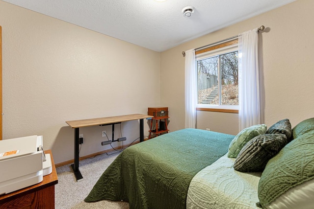 bedroom featuring carpet flooring and baseboards