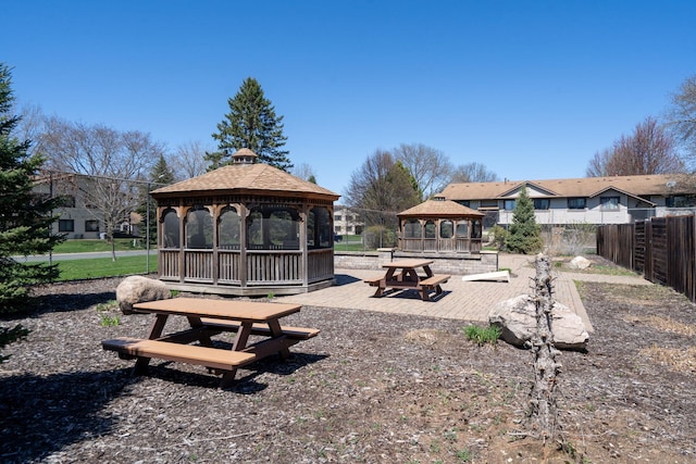 view of community with a gazebo and fence