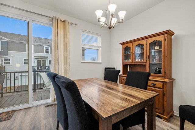 775 Roselyn Dr, Victoria, MN 55386 - dining room with light wood finished floors and an inviting chandelier