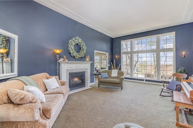 carpeted living room with a fireplace with flush hearth and a high ceiling