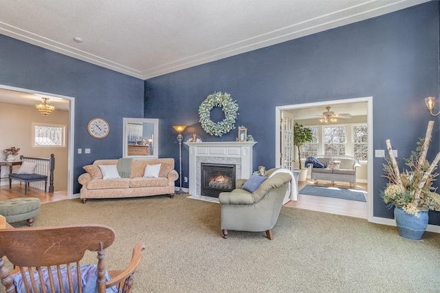 living room featuring carpet floors, plenty of natural light, a fireplace, and baseboards