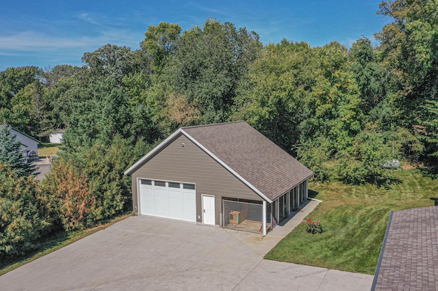 garage featuring aphalt driveway