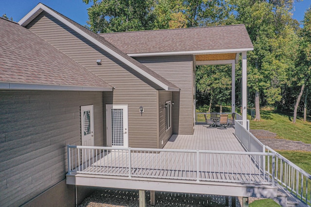 wooden deck with outdoor dining area