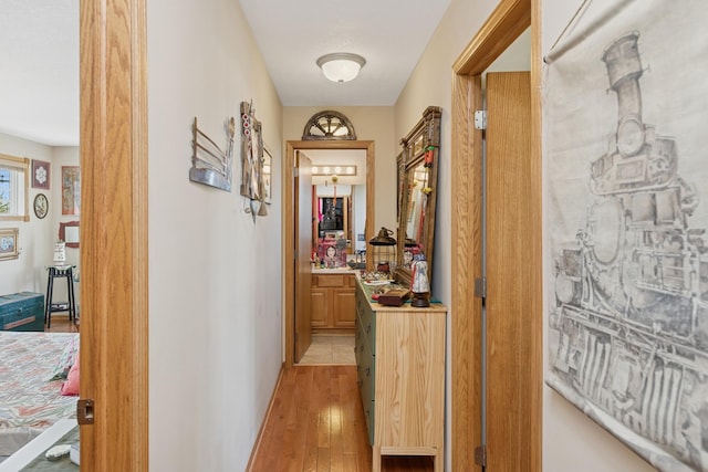 corridor featuring light wood-style flooring