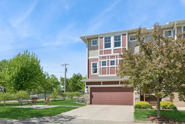 1920 Red Maple Ln, Northfield, MN 55057 - view of front facade featuring a garage, driveway, stone siding, and a front yard