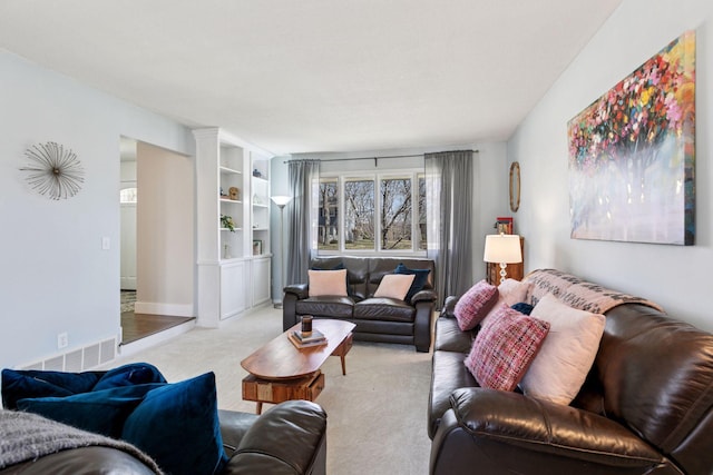 living room featuring visible vents and carpet floors