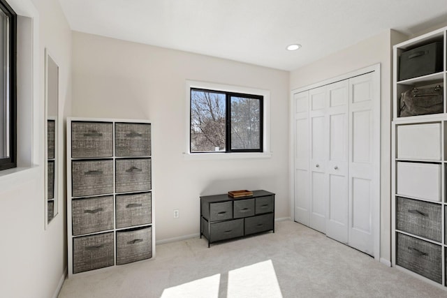 unfurnished bedroom featuring recessed lighting, baseboards, carpet, and a closet