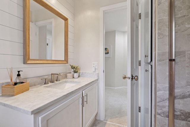 bathroom with baseboards and vanity