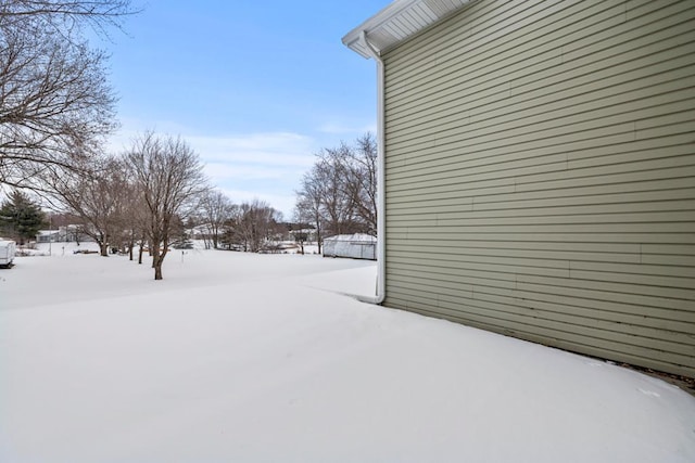 view of yard layered in snow