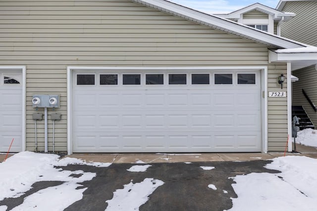 view of snow covered garage