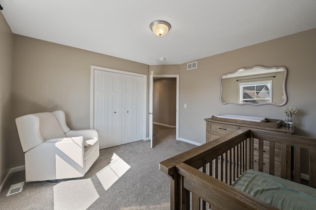 bedroom with carpet flooring, a closet, and baseboards