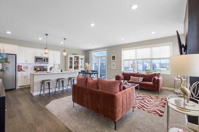 3459 109th Ln NE, Blaine, MN 55449 - living room featuring plenty of natural light, dark wood-type flooring, recessed lighting, and baseboards