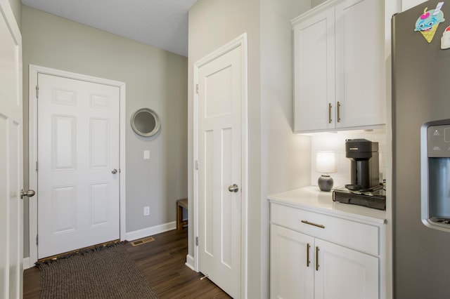 3459 109th Ln NE, Blaine, MN 55449 - bar featuring stainless steel refrigerator with ice dispenser, dark wood-style flooring, baseboards, and decorative backsplash