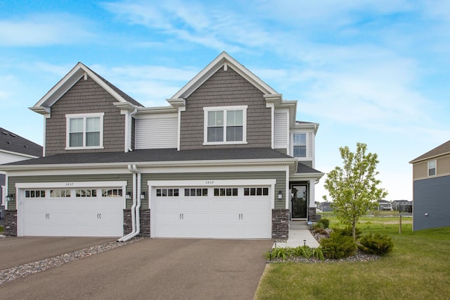 3459 109th Ln NE, Blaine, MN 55449 - view of front of property featuring stone siding, driveway, a garage, and a front lawn