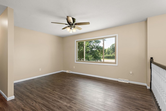 15320 90th St NE, Otsego, MN 55330 - unfurnished room featuring a ceiling fan and dark wood-style floors