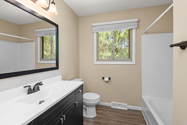 15320 90th St NE, Otsego, MN 55330 - full bathroom featuring vanity, wood finished floors, and shower / washtub combination