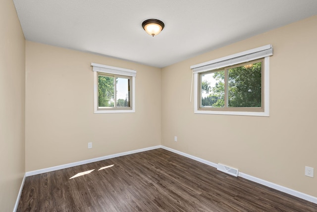 15320 90th St NE, Otsego, MN 55330 - unfurnished room featuring dark wood-style floors and baseboards