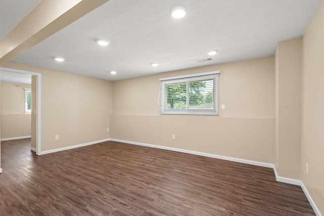 15320 90th St NE, Otsego, MN 55330 - spare room featuring plenty of natural light, dark wood finished floors, recessed lighting, and a textured ceiling