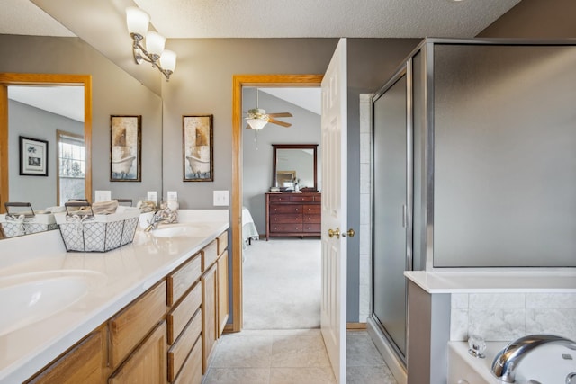full bath featuring double vanity, a sink, ensuite bathroom, and a stall shower