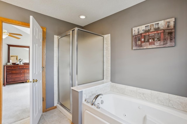 bathroom with a whirlpool tub, tile patterned floors, a textured ceiling, and a stall shower