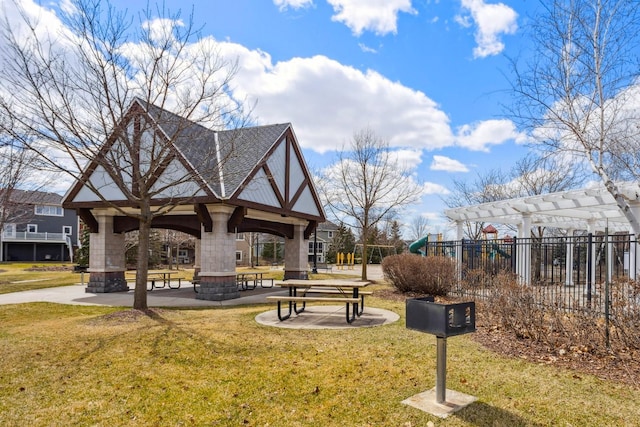 view of property's community with a gazebo, a lawn, fence, and a pergola