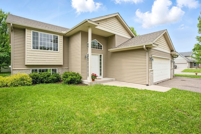 10310 Kaitlin Ave, Hanover, MN 55341 - view of front of house with a front lawn, a garage, driveway, and a shingled roof