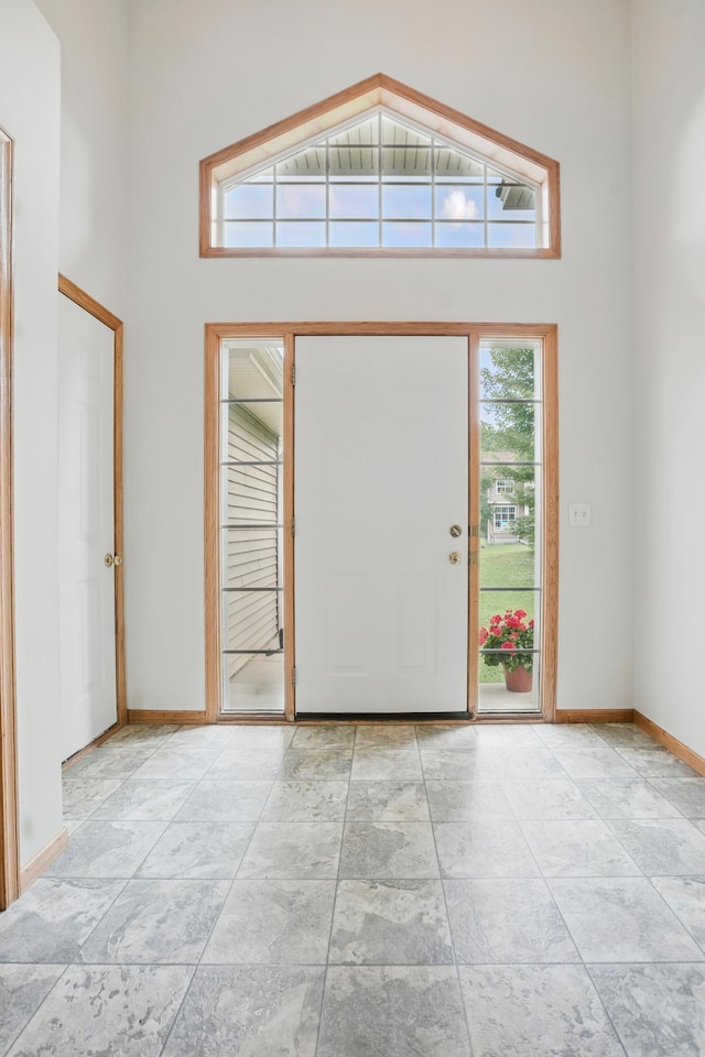 10310 Kaitlin Ave, Hanover, MN 55341 - entrance foyer with a high ceiling, healthy amount of natural light, and baseboards