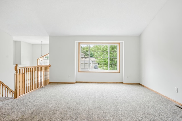 10310 Kaitlin Ave, Hanover, MN 55341 - spare room with carpet floors, healthy amount of natural light, and baseboards