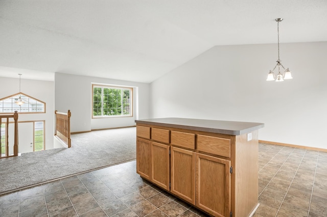 10310 Kaitlin Ave, Hanover, MN 55341 - kitchen featuring a chandelier, vaulted ceiling, dark colored carpet, decorative light fixtures, and open floor plan