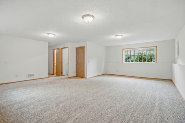 10310 Kaitlin Ave, Hanover, MN 55341 - empty room with baseboards, light colored carpet, and a textured ceiling