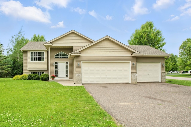 10310 Kaitlin Ave, Hanover, MN 55341 - view of front facade featuring a garage, asphalt driveway, a front lawn, and a shingled roof